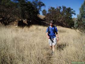 Brian approaching the Cott Tank Exclosure on AZT Passage 3.