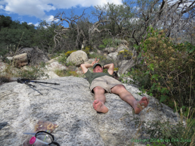 Taking a break at a spring, Jerry says, 'Peace out, man.'