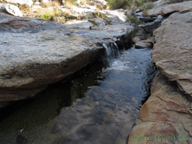 Water falls into a pool on Chimenea Creek.