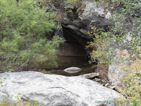 A little pool under some overhanging rock.