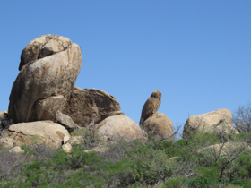 A stone owl perched on a rock.