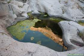 A glassy black pool in Horse Camp Canyon