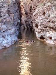 Jeff swims through Little Blue Box on Little Blue Creek.