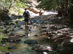 Jeff hiking down Little Blue Creek.