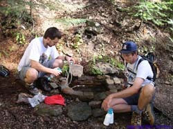 Brian and Brad fill up various water containers.