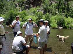 Chuck and I filter water, wowing the crowd of enthralled spectators.  Even CJ the dog stopped to watch.