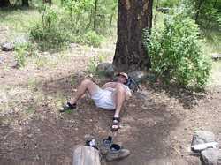 Jeff 'Where's the Hotel?' Hansen sleeps under a tree near the Black River.