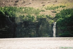 The large waterfall plunging in to Buffalo Woman Lake.