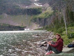 Shan bracing herself against the wind at Buffalo Woman Lake.