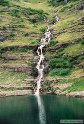 The large waterfall plunging in to Beaver Woman Lake's companion lake.