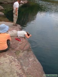 Andrea washes her hair in the Beaver Woman Lake companion lake.