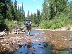 Here I am carrying Shan's pack across Nyack Creek.