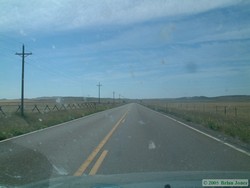 Driving across the wide-open range, I took an interest in these interesting range fences along the highway.