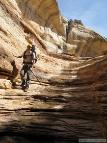 Steve descending the upper part of the pour-off in Bullet Canyon.