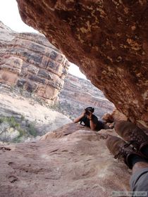 Brian taking a picture of Steve as he crawls across a narrow ledge at Jailhouse Ruin.