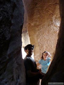 Brian and Mindy in a small slot in the canyon wall near Jailhouse Ruin.