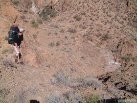 Steve climbing up the steep canyon slope out of the trap I planned ourselves into.