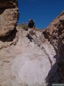 Steve planning his route down a bedrock chute.