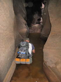 Chuck wading through a deep pool in Buckskin Gulch.