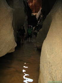 Brian and Steve wading down Buckskin Gulch.