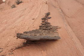An outcrop of iron-rich rock in a sandstone formation near Upper Buckskin Gulch.