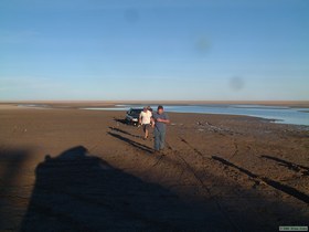 Brian and Brian (myself) hooking tow straps up to the stuck Ford.