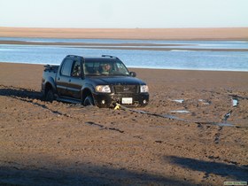 Hmm. . .  Really stuck truck.  Incoming tide.  Not good.