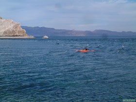 Brian paddling out of the tidal battle zone.