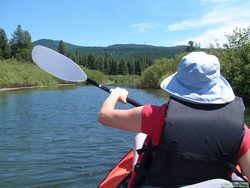 Shan paddling down the Clearwater River.