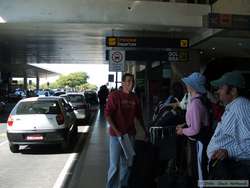 Meeting Fabricio at the airport, waiting for Marclei to bring the van around.