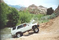 Dave climbs out of the last crossing of Mill Creek before we headed back to Moab.