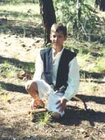 Cousin Paul, our ringbearer, kneels hoping to be knighted soon.